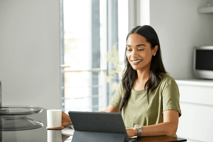 woman-drinking-coffee-reading-shareholder-communication