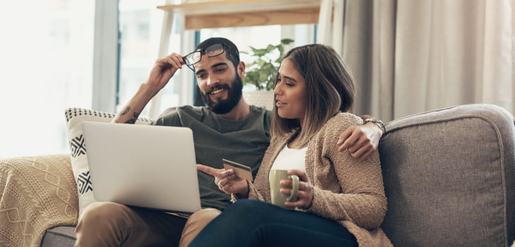 couple-tracking-a-wire-transfer-on-their-laptop