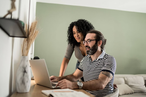 Couple checking their Questrade account