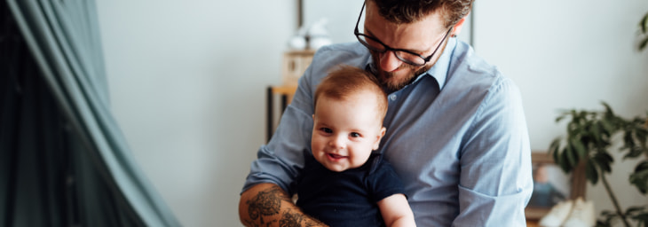 Dad and baby smiling