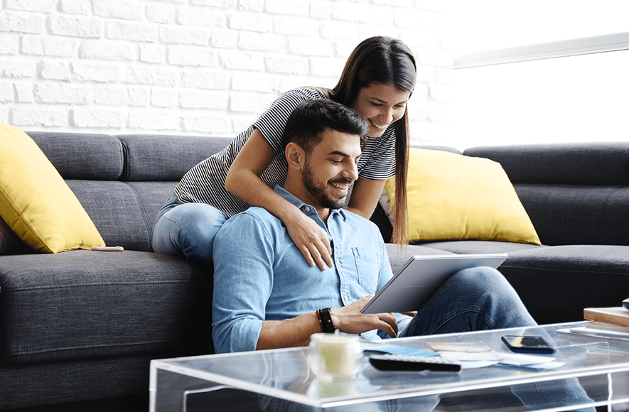 Couple on tablet looking at tfsa desktop