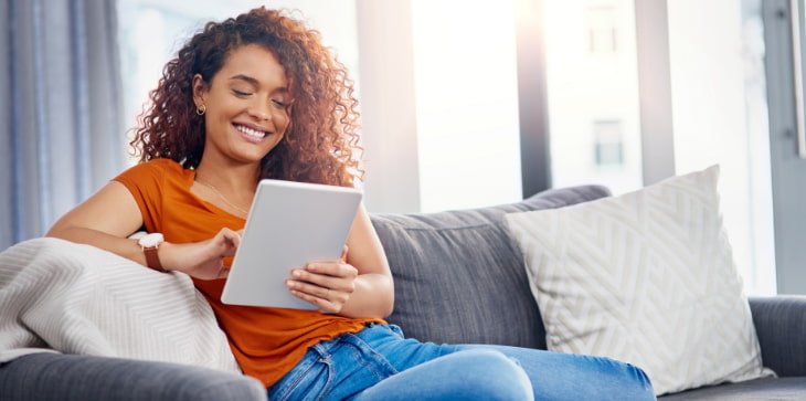 Young woman curly hair with tablet
