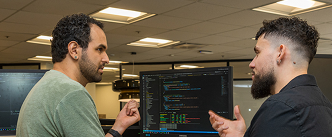 Two Software Engineers working and chatting